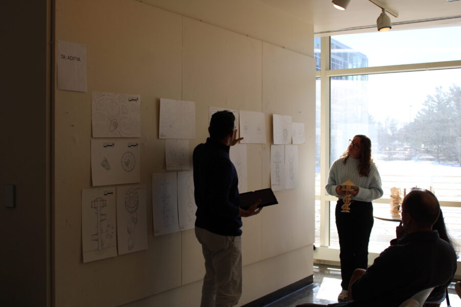 Reviewer pointing to student's work