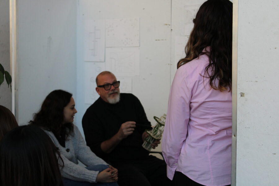 Reviewer giving a student feedback on their model