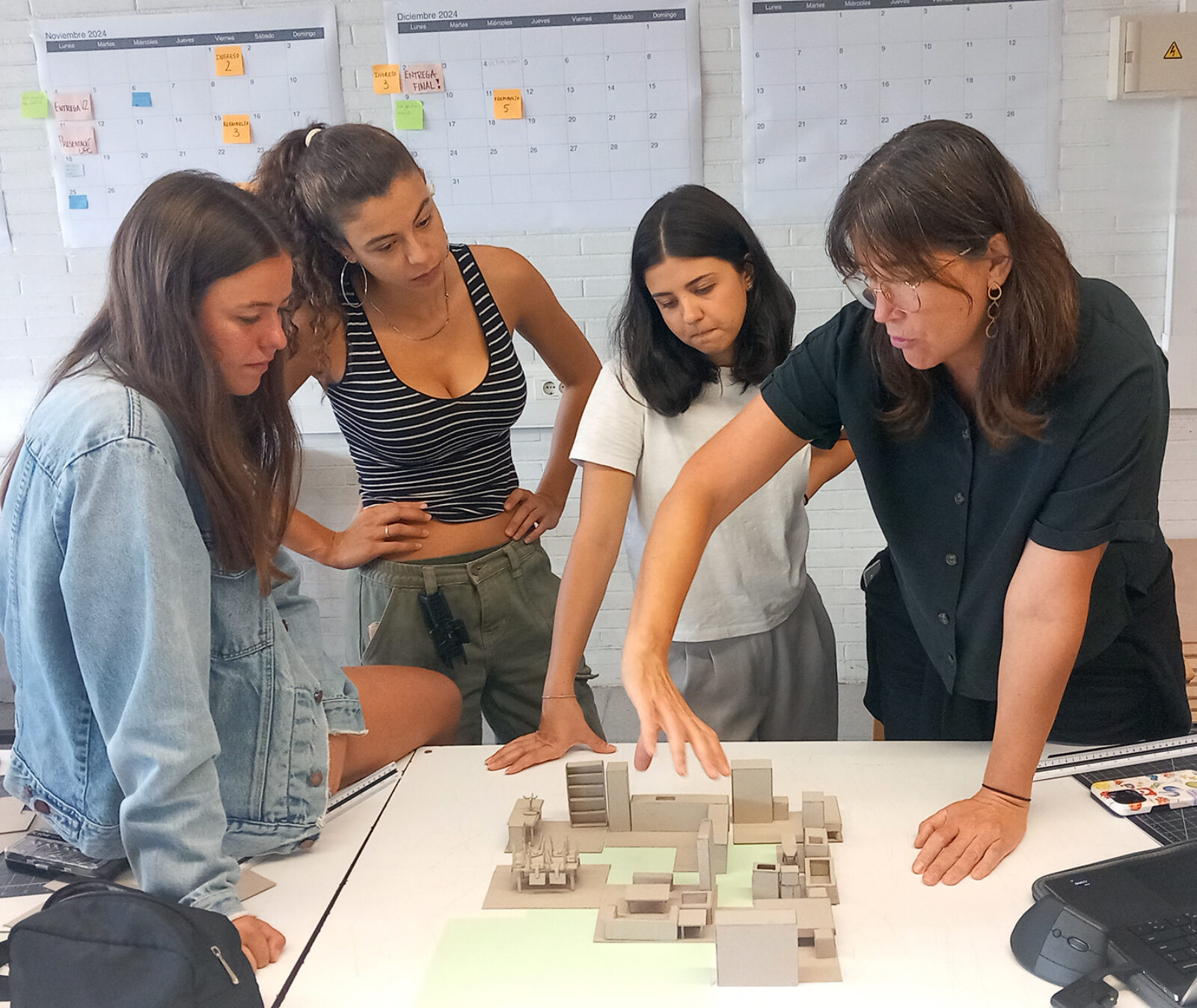 students standing together working on model