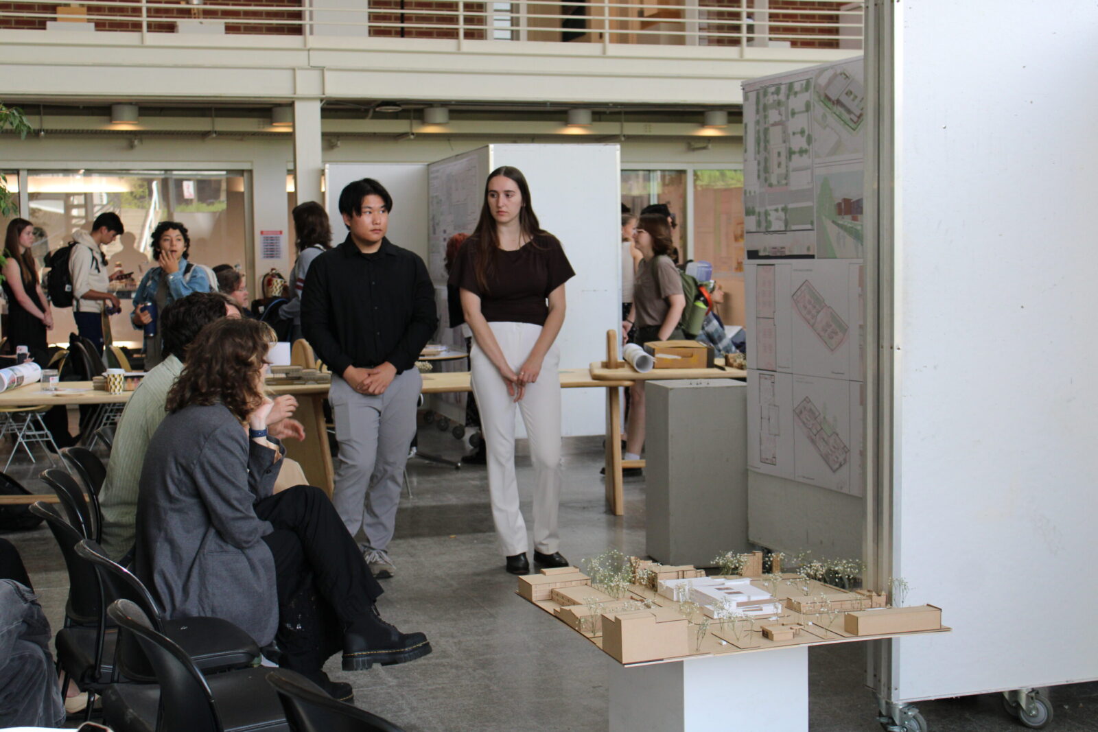students and jury looking at work