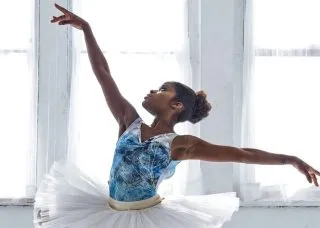 Ballerina with arms out