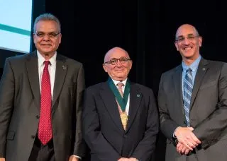 Walter Herbst with two NAI officials