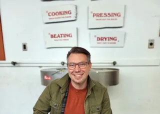 Professor Eric Benson sitting in a chair