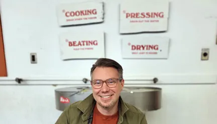 Professor Eric Benson sitting in a chair