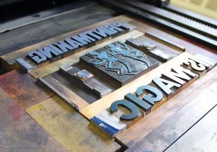 Photo of relief blocks on a printing press