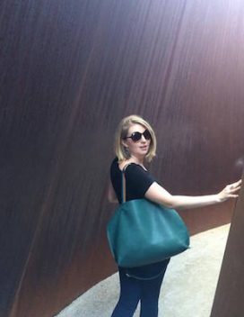 Portrait of the smiling student in an immersive artwork by Richard Serra