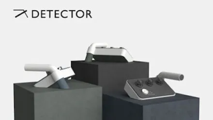 Three small white and gray electronic devices on pedestals