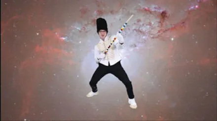 Photo of an active figure posing before a celestial background