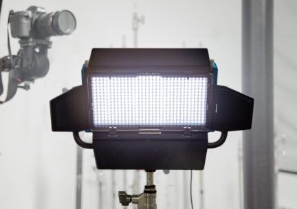 LED light on stand in front of camera