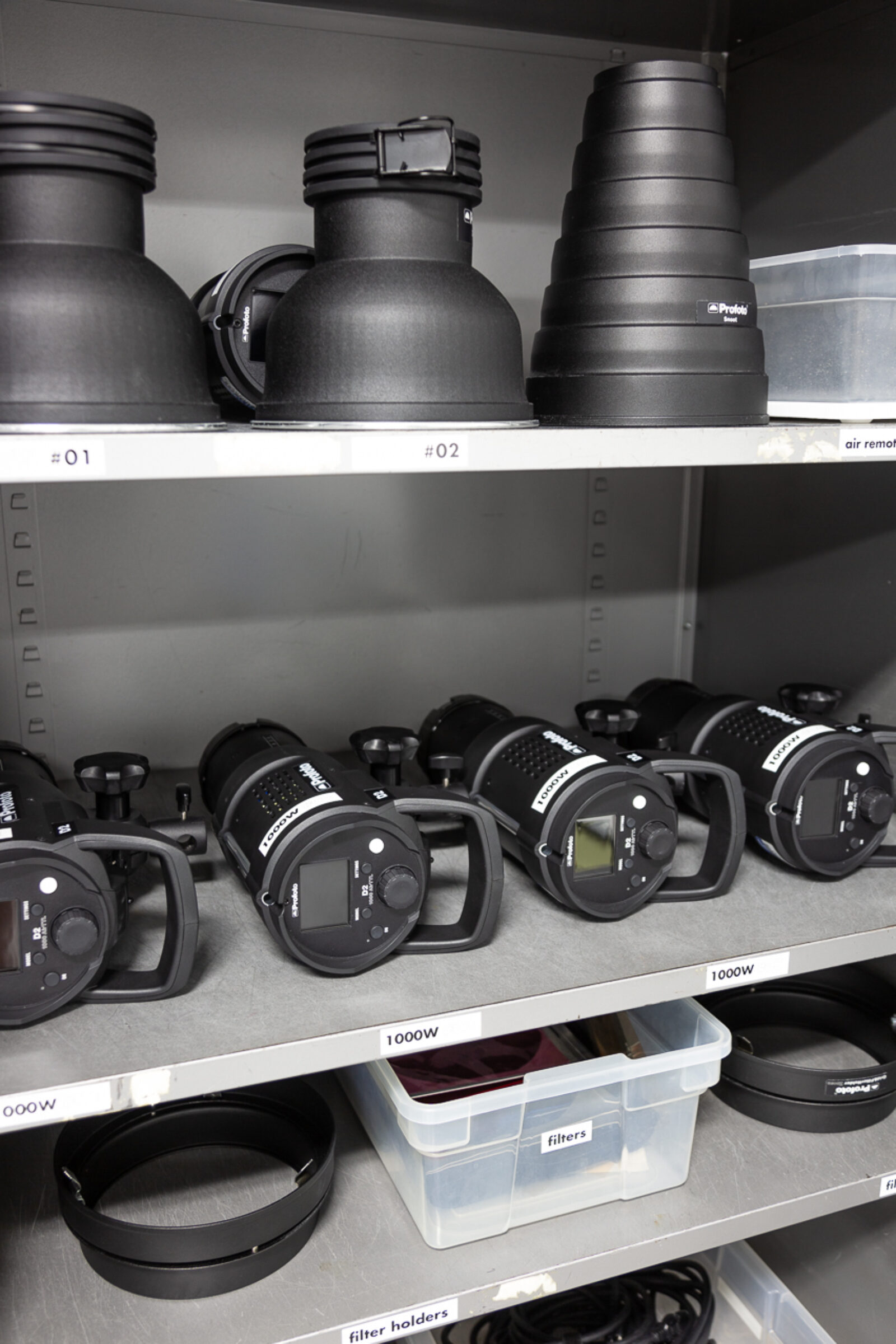 cabinet full of profoto studio lighting equipment