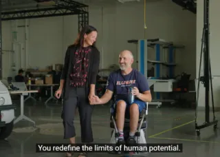 laura and adam bleakney walking together while adam in PURE