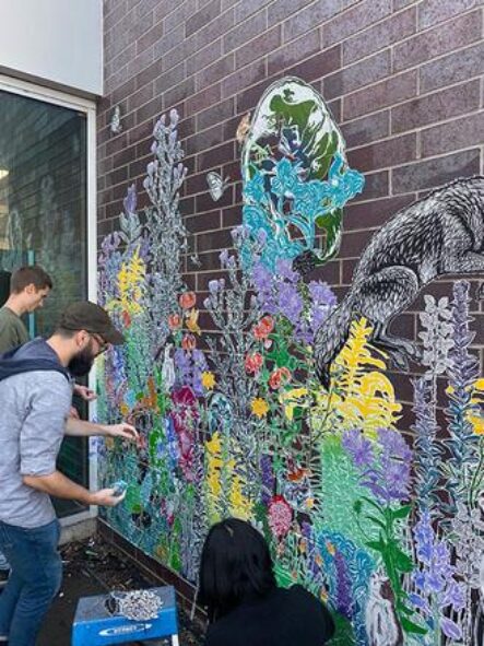 students working on mural