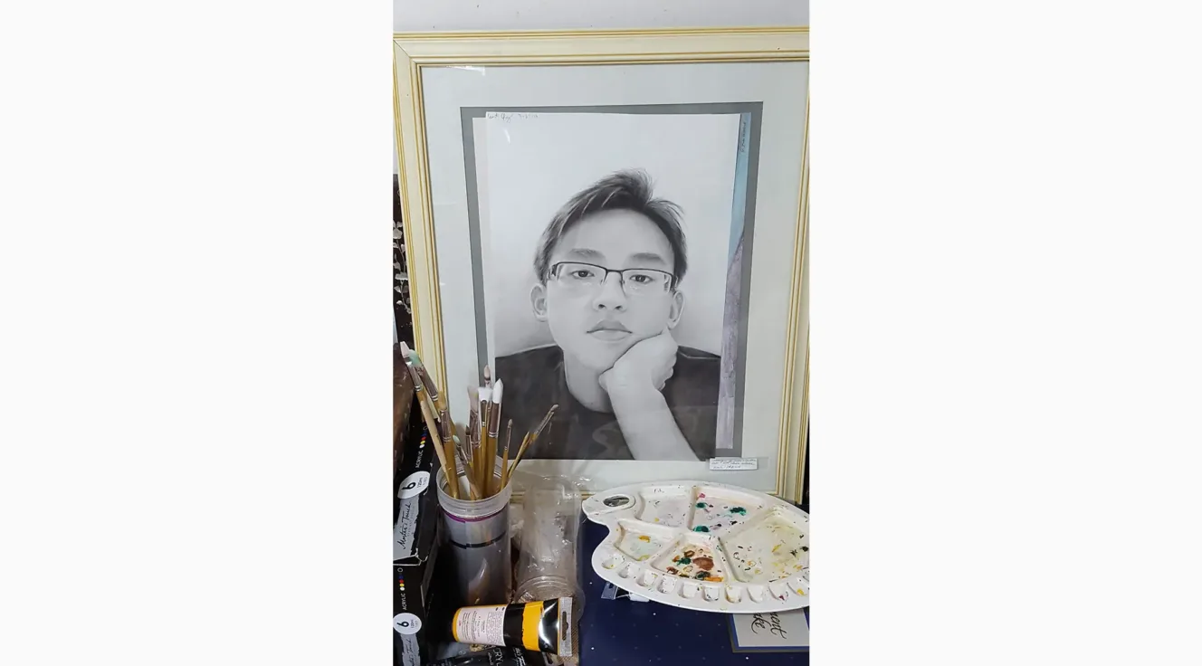 Self portrait of Curtis Chung drawn in charcoal 