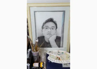 Self portrait of Curtis Chung drawn in charcoal 