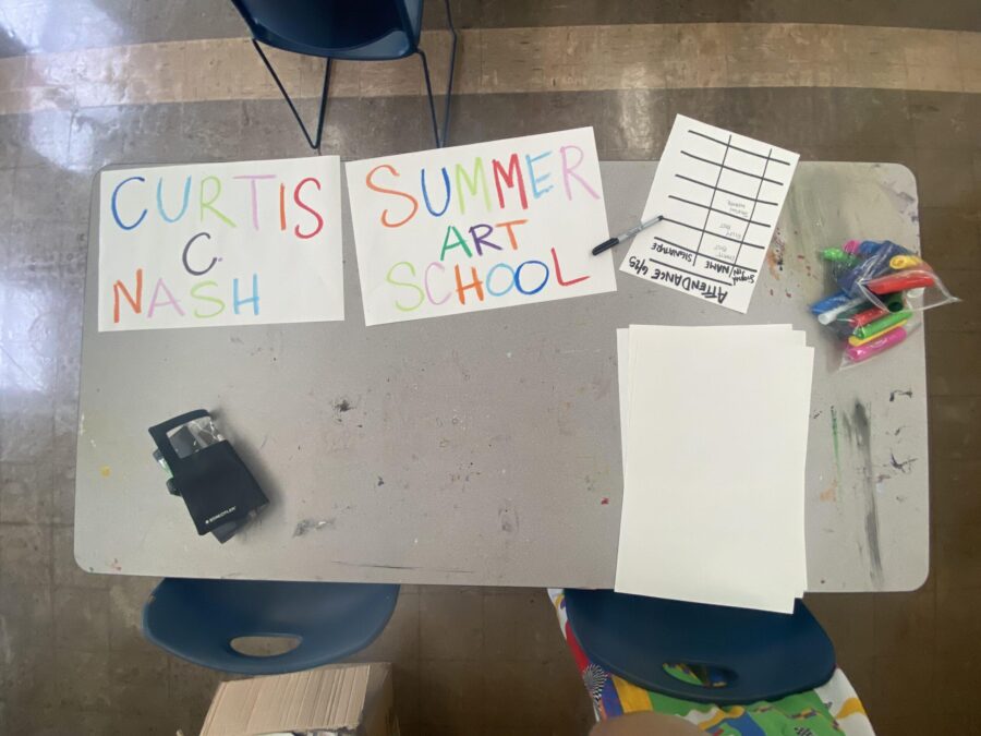 a handmade colorful sign of the NASH summer school