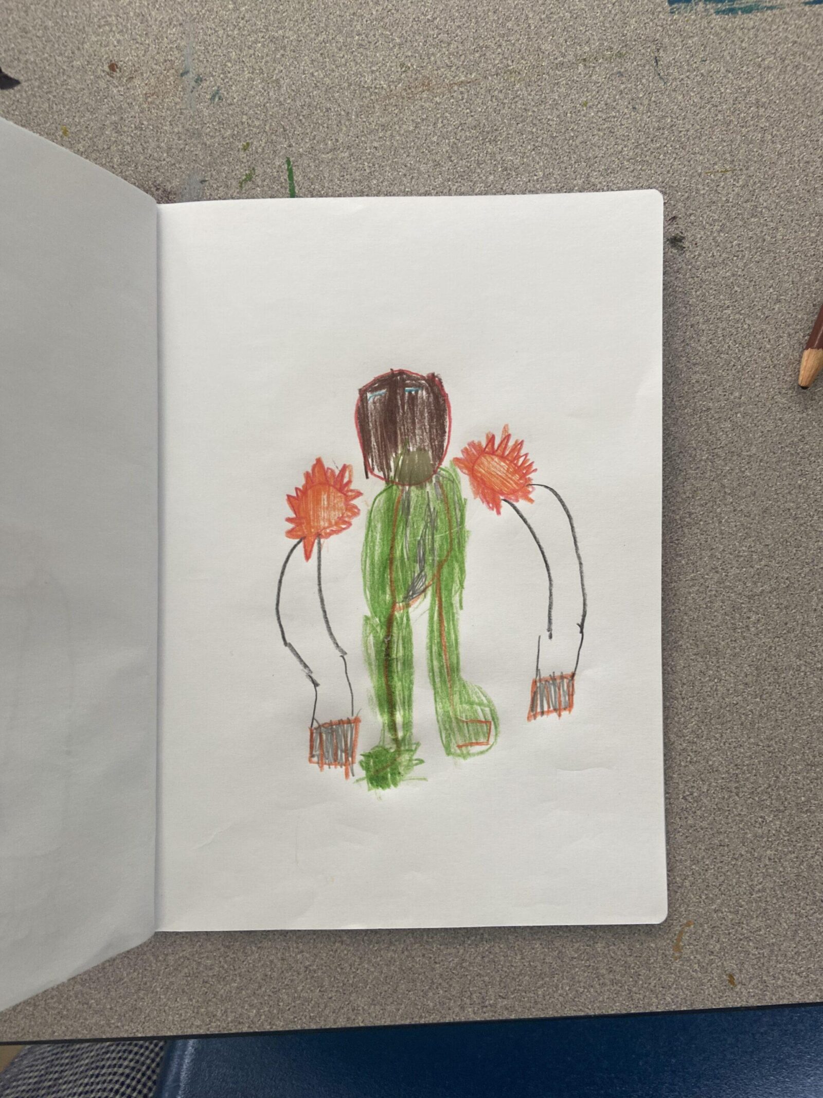 a child's drawing of a superhero in green and white