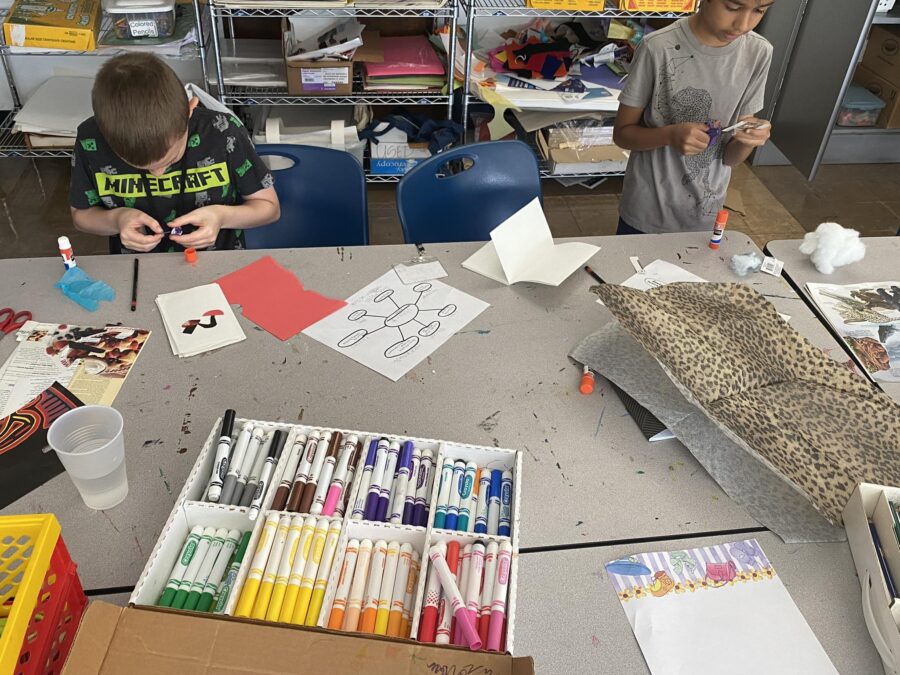 children seen making artworks
