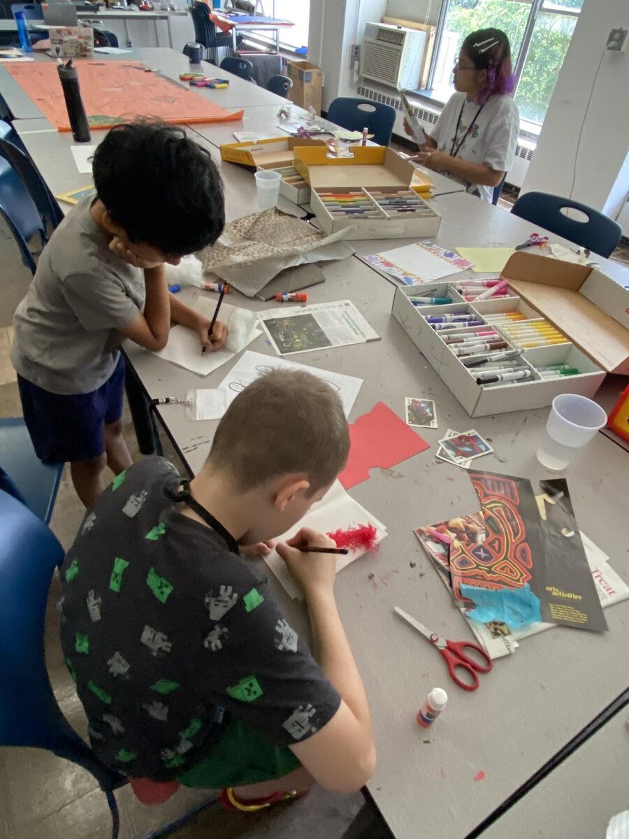 children and their teacher making artworks