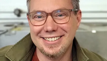 portrait of Eric Benson smiling