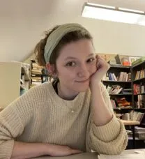 young woman sitting at a desk 