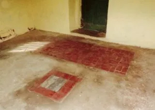 stone floor with brick inlays and open doorway