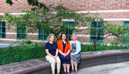 photo of Stephanie Ceman, Laura Hetrick, and Tracey Wszalek sitting outside Beckman