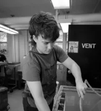 pesron working at a printmaking station