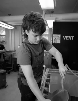 pesron working at a printmaking station