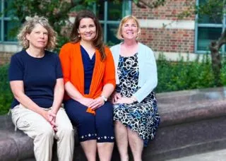 Dr. Stephanie Ceman, Dr. Laura Hetrick, and Dr. Tracey Wszalek sitting on bench outside Beckman Institute