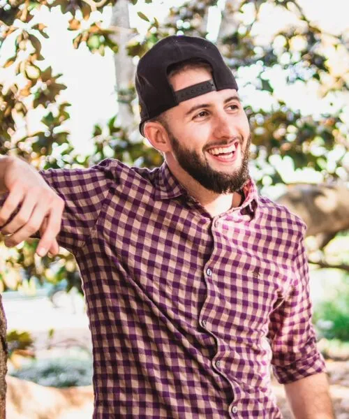 photo of Nate Mask with backward baseball cap and smiling