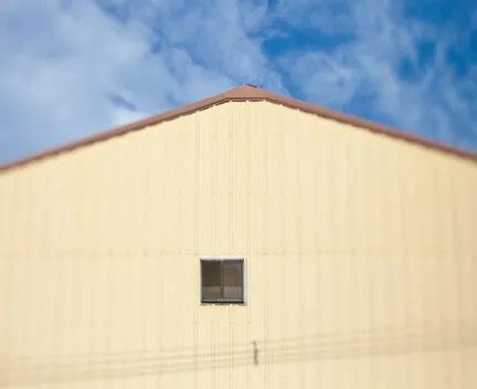 photograph of a building with yellow siding