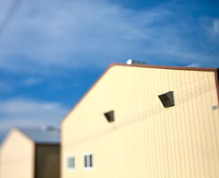 photo of buildings with yellow siding
