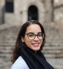 young woman in front of stairs
