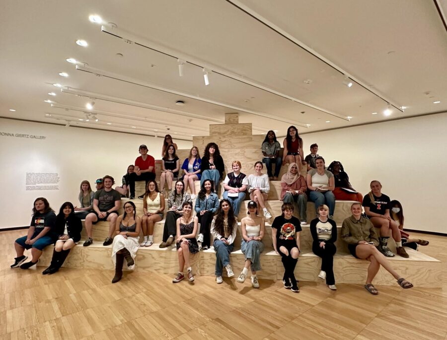 many people sitting on art display