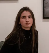 young woman with long hair in black shirt