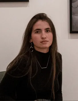 young woman with long hair in black shirt