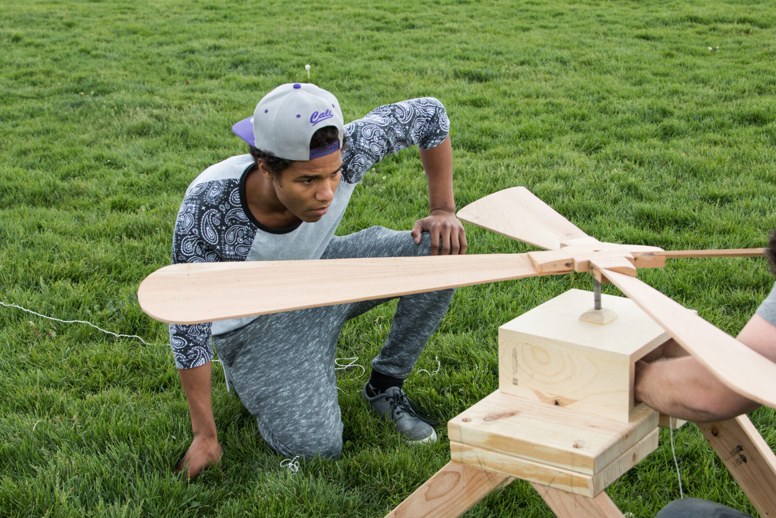 student looking at sculpture