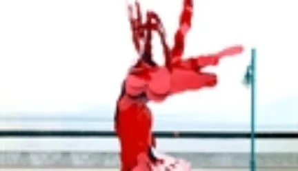 a red sculpture of Ruth Aizuss Migdal