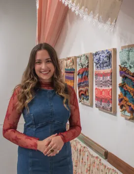 woman in front of artwork