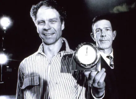 Merce Cunningham and John Cage smile in this black and white photo