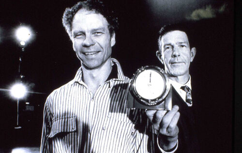 Merce Cunningham and John Cage smile in this black and white photo