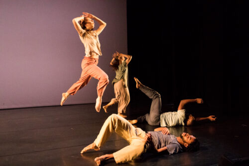 dancers jumping through the air