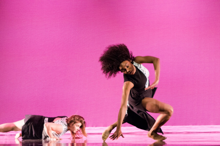 two dancers, one in foreground in motion