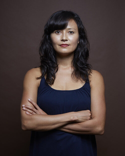 Headshot of Michelle with arms crossed