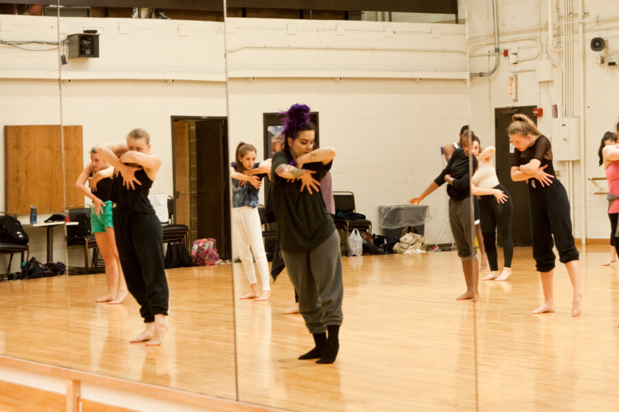 Dancers reflected in mirrors