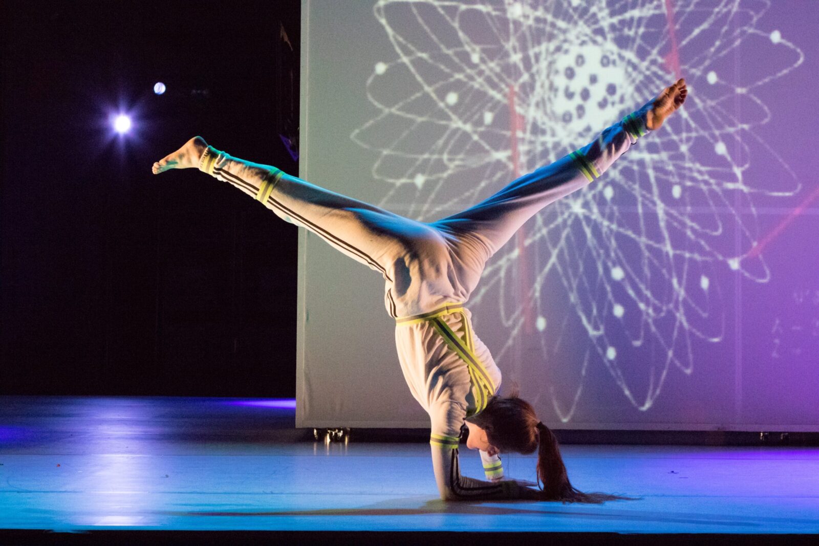 A dancer does a handstand