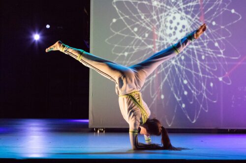 A dancer does a handstand