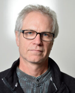 A headshot of John