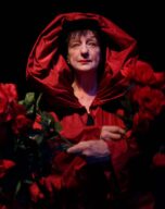a photo of Beverly with a red hood and flowers