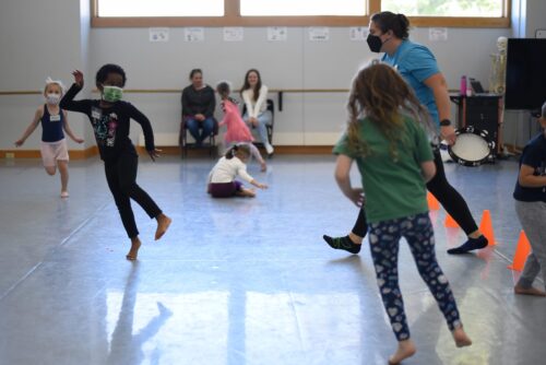 Children dance inside the studio